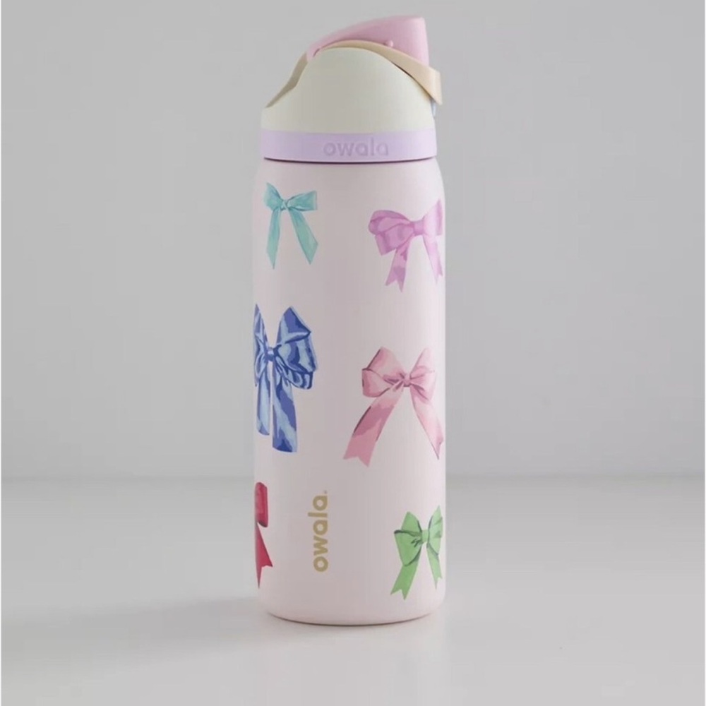 Owala Pink Water Bottle with Bow Design.